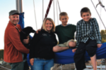 Danny, Hope the dog, Kari, Avery, and Harrison aboard Olo 2.
