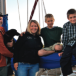 Danny, Hope the dog, Kari, Avery, and Harrison aboard Olo 2.