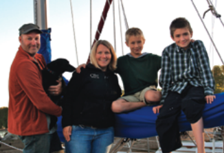 Danny, Hope the dog, Kari, Avery, and Harrison aboard Olo 2.