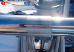 In the ends of the 1-inch tube, I cut slots approximately 1 inch long. These would allow me to use clamps to hold this outer tube in position on the inner tube.