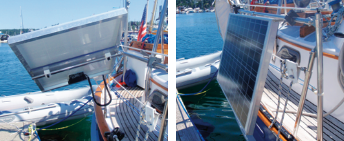 The plastic rail clamps beneath the panels are used to adjust the panels in the fore-and-aft direction and to lock them in position, at left. The panels have so far withstood 25-plus knots of wind with moderate seas. During docking maneuvers or in extreme weather, we can rotate the panels to a flat “stowed” position, at right.