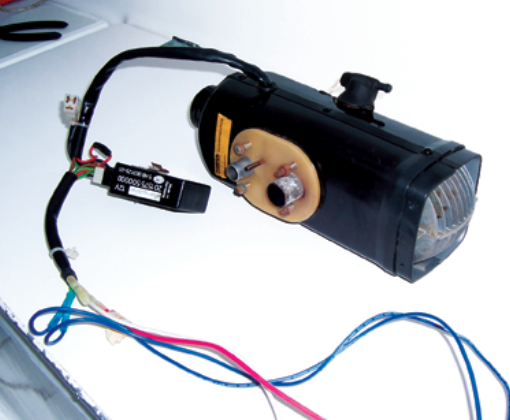No bigger than a loaf of bread, the diesel heater requires six connections: electrical, fuel, exhaust, and three for air.