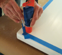 After preparing the surfaces, Stephen masked around the areas to be coated.