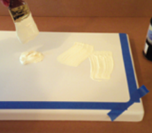The first step in the application was to place piles of paint on the surface.