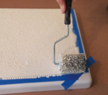The special roller works the paint onto the surface and gives it its “grippy” texture.