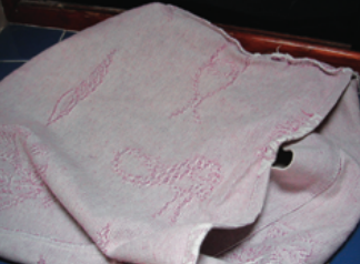 When sewing a cushion cover, turn the fabric inside out, fold the small flap over, then bring the long side up past the fold. After it’s sewn and turned right side out, the flap keeps the clothes in the cover.