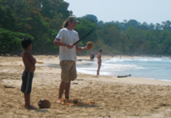 A man opening a coconut