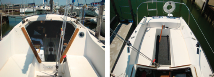 The wide companionway makes for easy egress, but you have to get by the mainsheet tackle first, at left. The cockpit coamings are sufficiently high to provide decent back support. The gas tank for the outboard motor is in the lazarette aft of the tiller, at right.