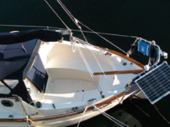 Because of the outboard rudder, the tiller takes up little room in Sisiutl’s cockpit which, being compact, has seagoing potential. A solar panel helps keep the battery charged when the boat’s at sea.