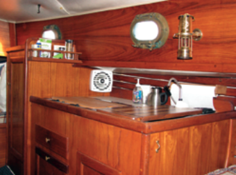 Like all the boat’s features, the galley is compact. The quality of Pacific Seacraft’s craftsmanship is apparent in the woodwork, which has survived 30 years of use very well.