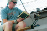 Dennis sets up his Twins to steer the boat while he devotes time to other important aspects of sailing . . .