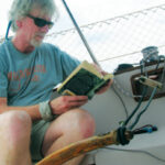 Dennis sets up his Twins to steer the boat while he devotes time to other important aspects of sailing . . .
