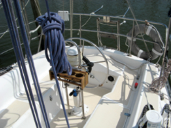 The spacious cockpit has a modified T shape, making it possible to get around the wheel without stepping up on the seats — a good safety feature. The heavy-duty mainsheet traveler is mounted on the bridge deck.
