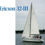 In about 6 knots of wind, Raconteur, the Ericson 32-III of Jerry and Jean Riggs, glides along leaving very little wake. The hull’s lines are still attractive, even though the style of the reverse transom gives away her age. Note the signature Ericson portlights in the cabin trunk.