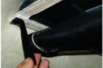 A Velcro tab holds the rolled-up screen at the ready but out of the way until it’s needed to keep out invading insects.