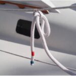 With one end made fast on the boat and the other tucked into a ring on the lifeline, Michael’s dockline is set up so a helper on the dock can easily grab it and take it to a dock cleat.