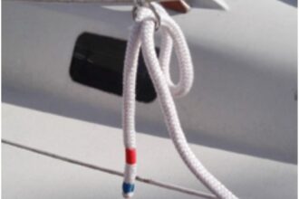 With one end made fast on the boat and the other tucked into a ring on the lifeline, Michael’s dockline is set up so a helper on the dock can easily grab it and take it to a dock cleat.