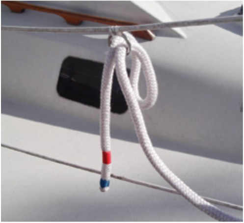 With one end made fast on the boat and the other tucked into a ring on the lifeline, Michael’s dockline is set up so a helper on the dock can easily grab it and take it to a dock cleat.