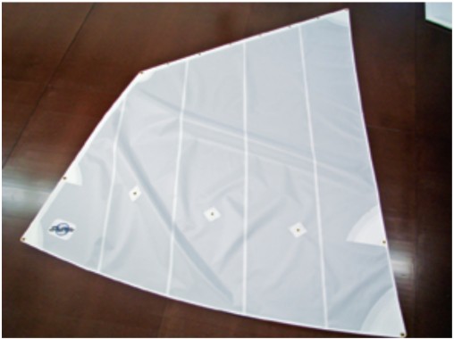 When assembled with care, the finished sail will rival that of any loft. Four-sided sails, like this one for a Nutshell dinghy, are also cut by computer. Details like reef point locations are marked on the sail panels to ensure proper placement.