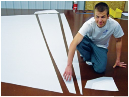 Panel edges are curved so that, when joined together, they create the desired shape in the finished sail. The computer leaves lines just inside the edges of the panels to guide the seaming process.