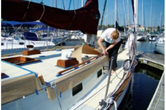 Susan Landry prepping the deck for retreading