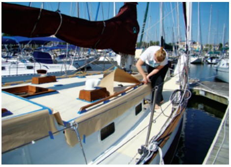 Susan Landry prepping the deck for retreading