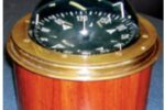 The finished binnacle in varnished mahogany sets off the vintage compass perfectly.