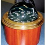 The finished binnacle in varnished mahogany sets off the vintage compass perfectly.