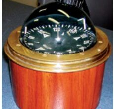 The finished binnacle in varnished mahogany sets off the vintage compass perfectly.
