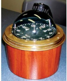 The finished binnacle in varnished mahogany sets off the vintage compass perfectly.