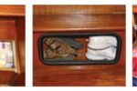 With a little carpentry work, Chuck exploited unused space behind and under the boat’s stairs, at left and center. Out-of-season clothes are “vacuum” packed, at right.