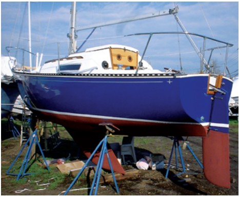 After a winter of work, the once forlorn little boat has regained her rudder, her good looks, and her dignity.
