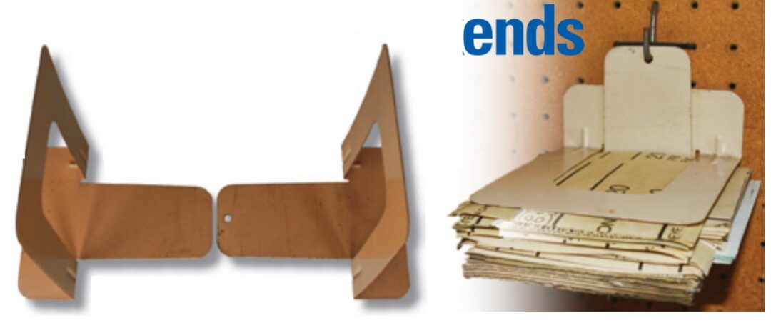 Stan dissuades his sandpaper from becoming unruly by sandwiching it between bookends.