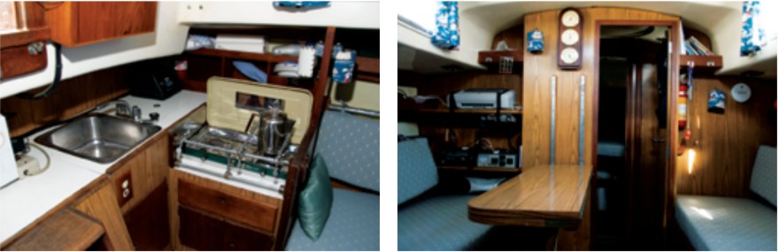 Good old test boat, Tomfoolery, has the “traditional” arrangement, in which the compact galley is laid out either side of the companionway, aat left. In the saloon, settees facing each other across the dining table make good sea berths, at right.