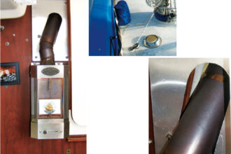 As well as providing welcome warmth, a cabin heater makes a charming addition to a sailboat’s saloon, facing page. It gets air from the deck vent and its smoke and fumes exit through the Charlie Noble, here under its canvas cover, above. Connecting the flue from the stove to the chimney produced some interesting angles, below right.