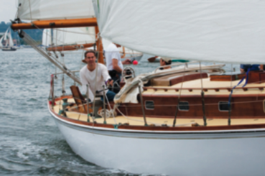 Cutting a fine wake in the wooden boat fleet was Helena, an H28 owned by Timothy Curtis.