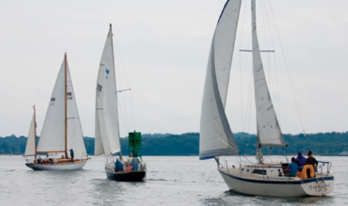 The Nevins 40, Prima Donna, skippered by David Puchkoff, leads Cielo Azul and the O’Day 28, Tradewind, owned by John Juergens, around a mark.