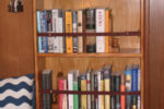 An avid reader and hands-on sailor, John Lively took matters into his own skilled hands to provide proper quarters for his essential cruising companions: books and tools.