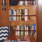 An avid reader and hands-on sailor, John Lively took matters into his own skilled hands to provide proper quarters for his essential cruising companions: books and tools.