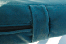 Excess boxing, folded, covers the zipper pull.