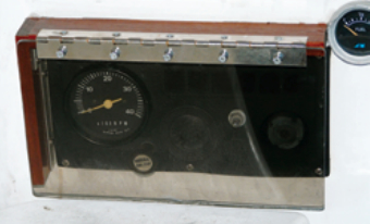 When closed, the cover protects the panel from wayward feet. Sealant along the edges keeps water from dripping behind the panel.