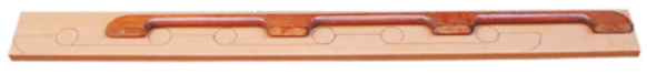 Tim made two handholds as a unit. He drew one along the bottom of the board, marked circles where he would bore holes to form the inside curves, then flipped the handhold and drew the copy, using the same circles.