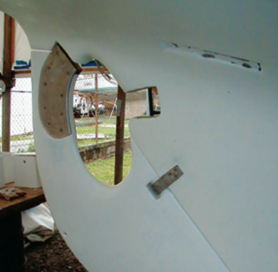 Caribee’s new rudder, barrier coated, primed, and installed, awaits the the final touch: antifouling paint.