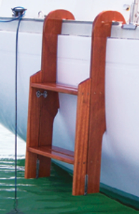 The solid-mahogany lower section hinges upward clear of the water and the treads of the two sections line up.