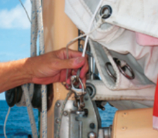 The Mainster’s wire luff hooks to a snap-shackle attached to the gooseneck.
