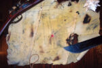 A tattered remnant of canvas bears the secret to where an intrepid father-and-son crew buried a hoard of treasured belongings.