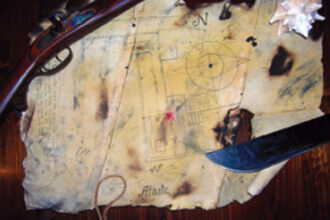 A tattered remnant of canvas bears the secret to where an intrepid father-and-son crew buried a hoard of treasured belongings.
