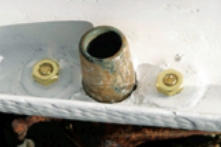 Oversized washers bedded in thickened epoxy under the oarlock sockets distribute the stresses. The sockets themselves are also bedded in epoxy to prevent play.