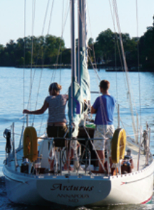 Andy and Mia motor Arcturus out of Mill Creek on Chesapeake Bay on their way to sail her in the 2008 Good Old Boat Regatta.