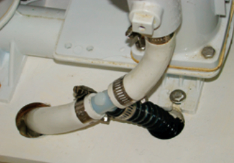 Chuck’s first step in installing a deckwash system was to insert a tee into the intake line for the forward head.